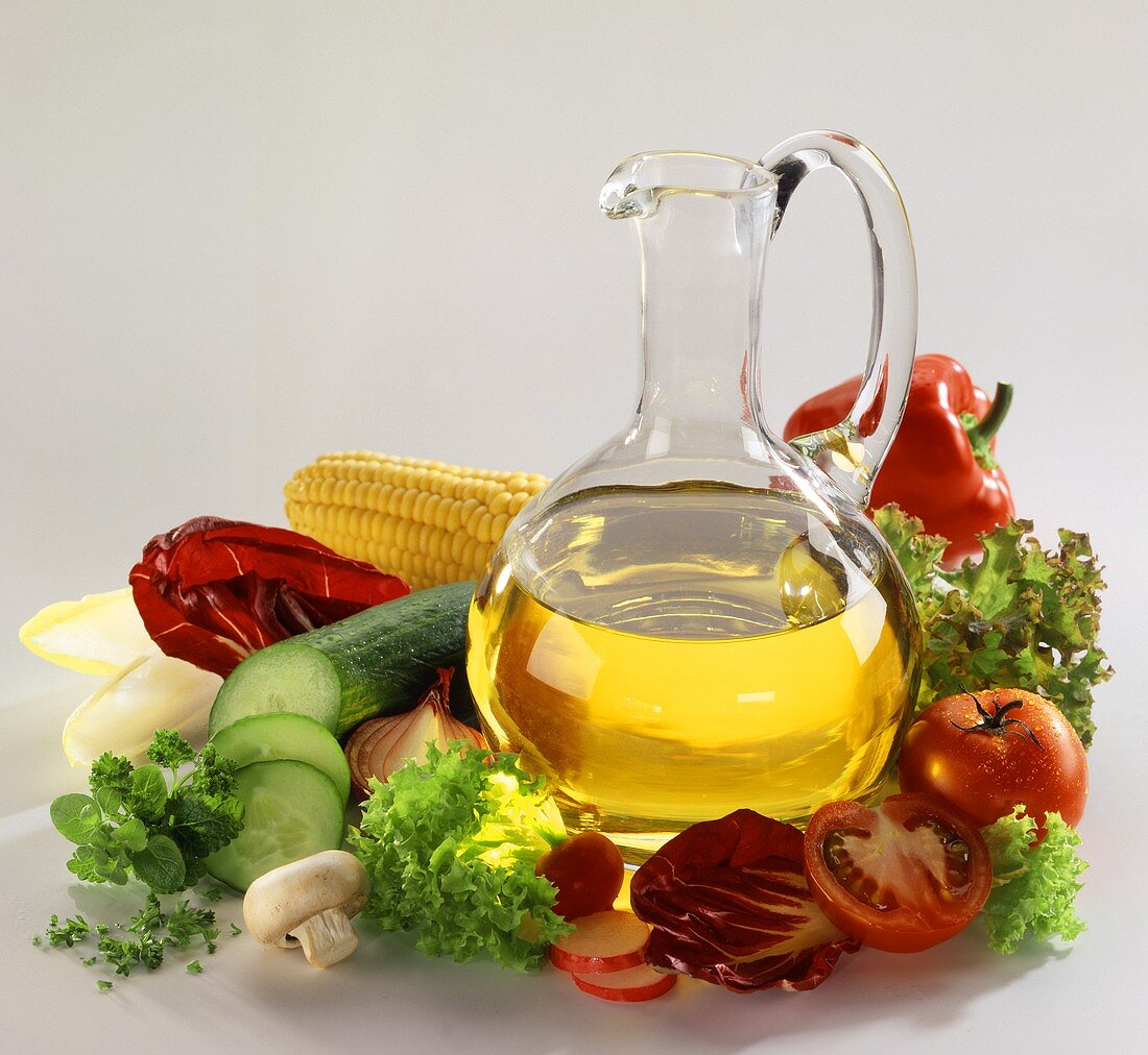 Still life with oil and salad ingredients