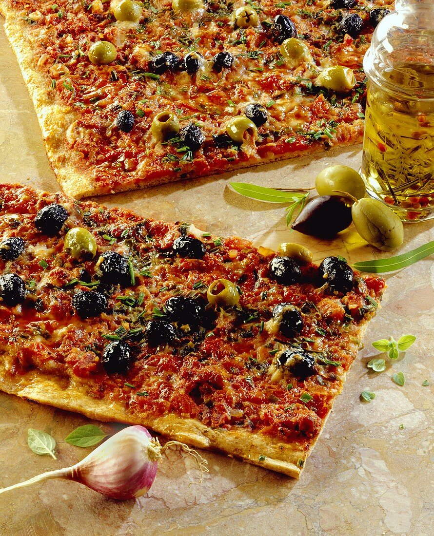 Pizza with green and black olives