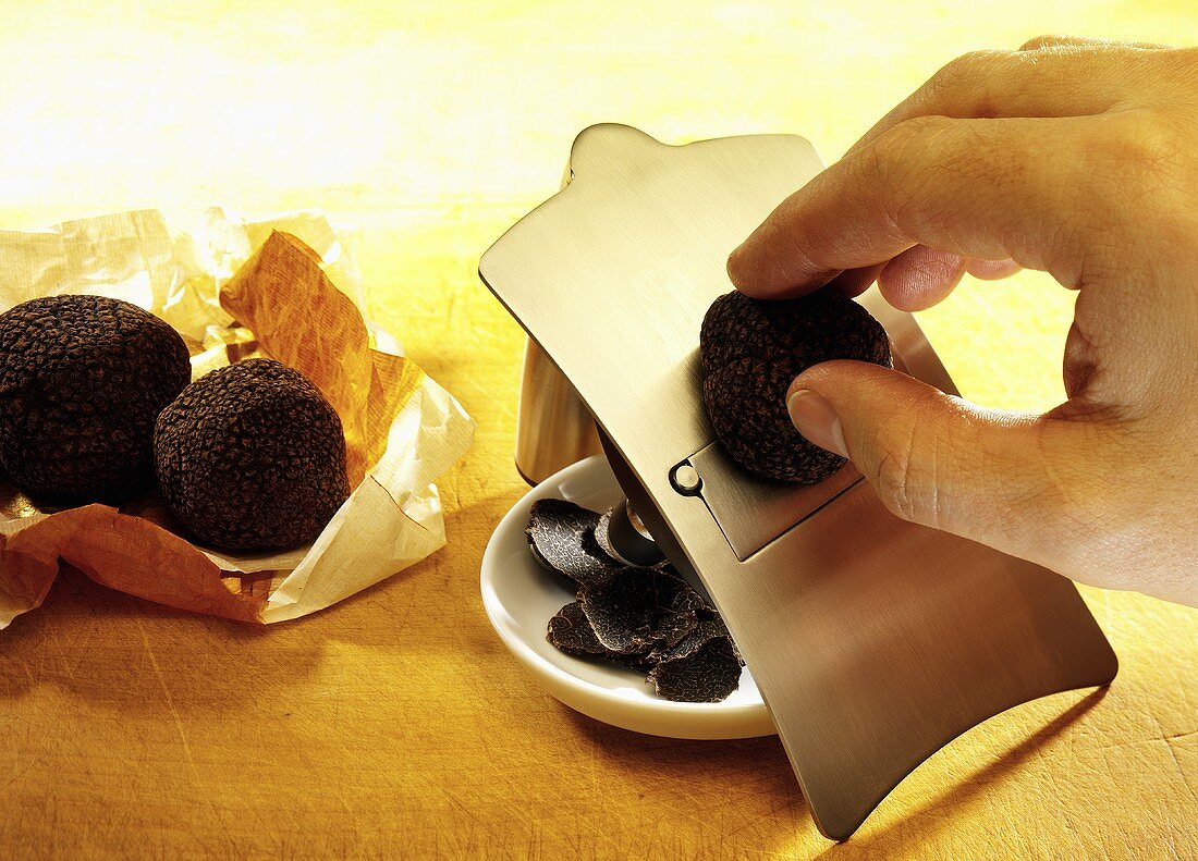 Black truffle being sliced