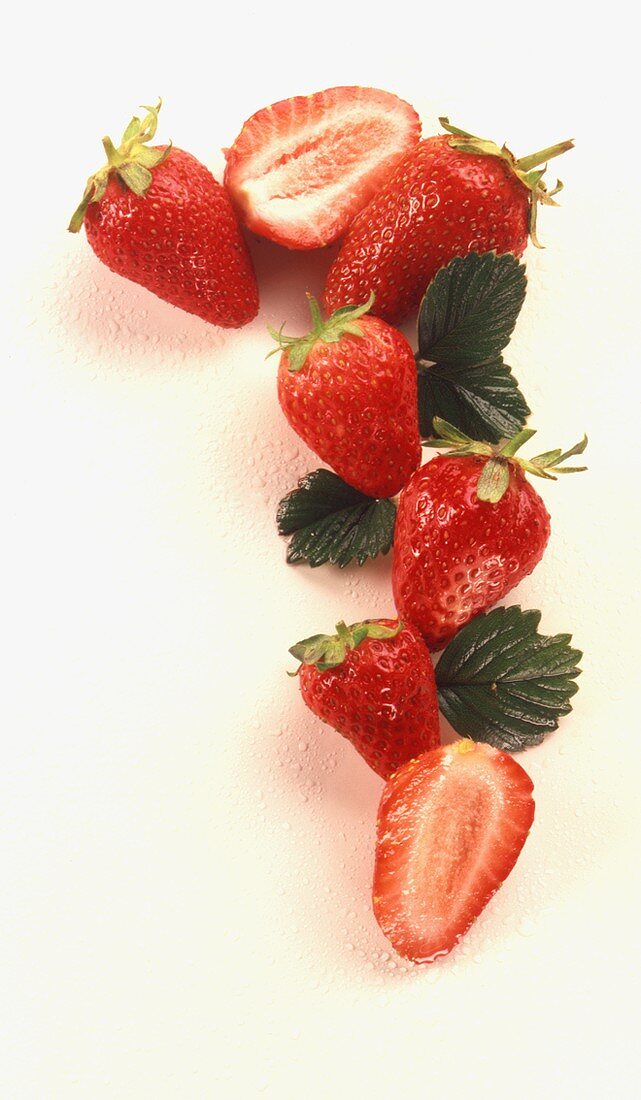 Halved and whole strawberries