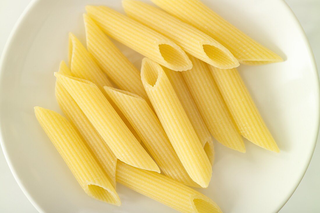 Several penne in a white dish