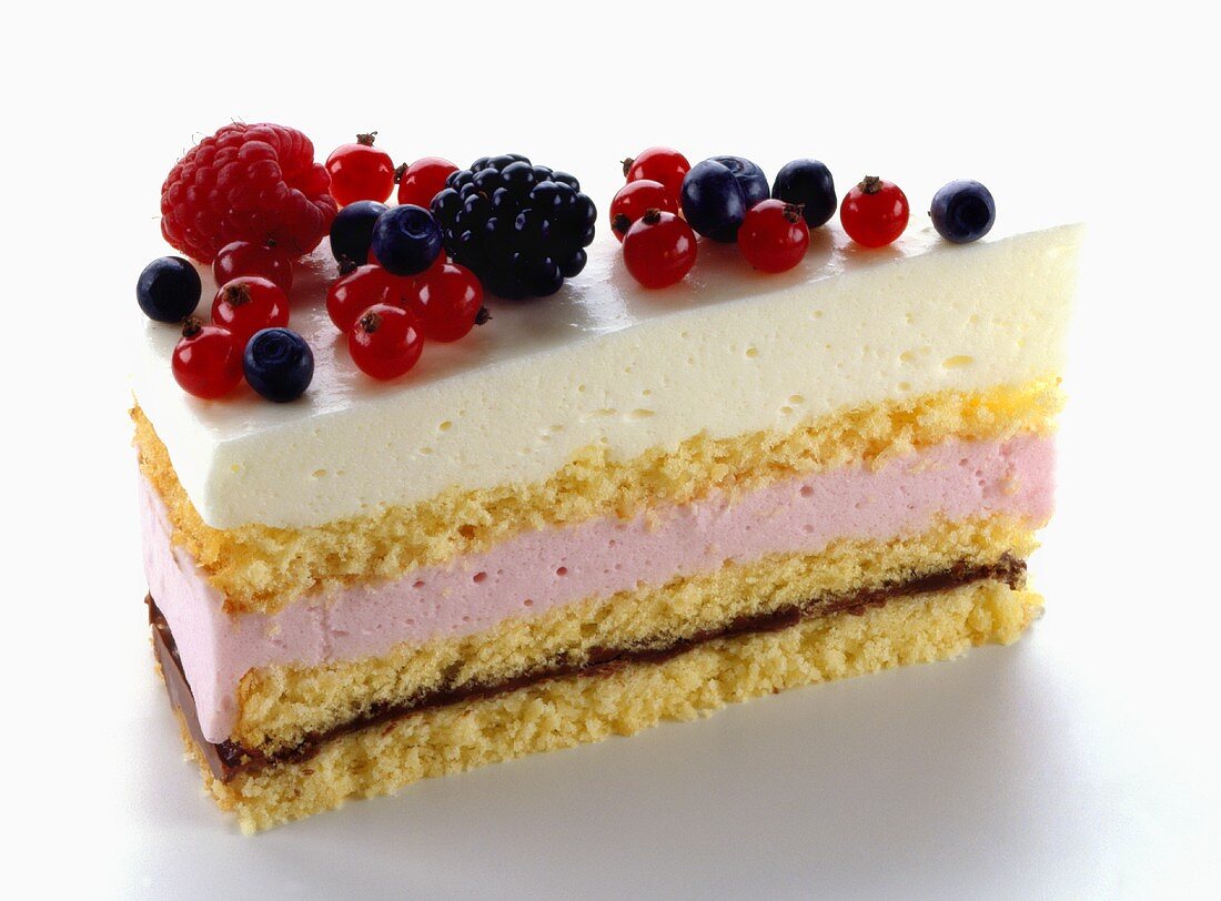 A piece of strawberry cream cake with wild strawberries