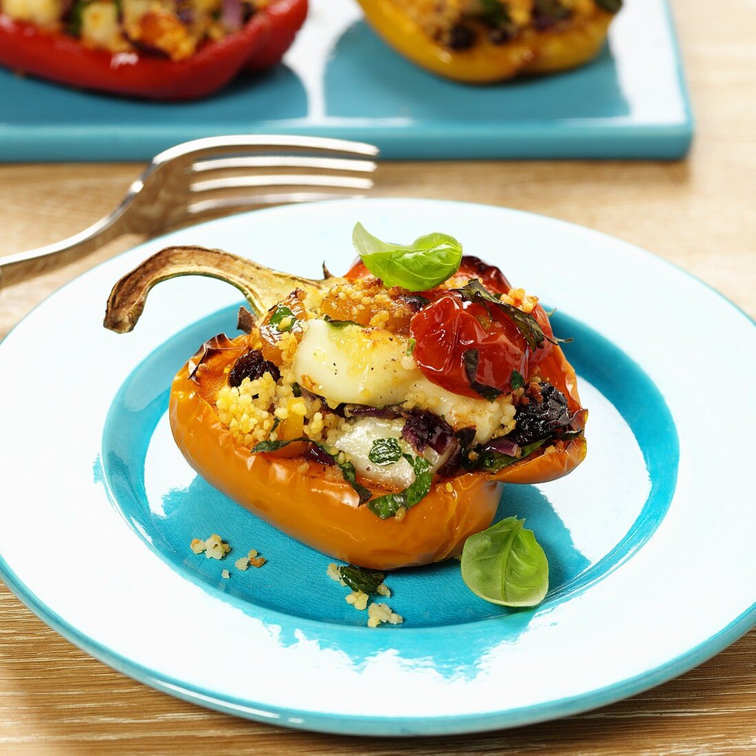 Pepper half stuffed with couscous and vegetables