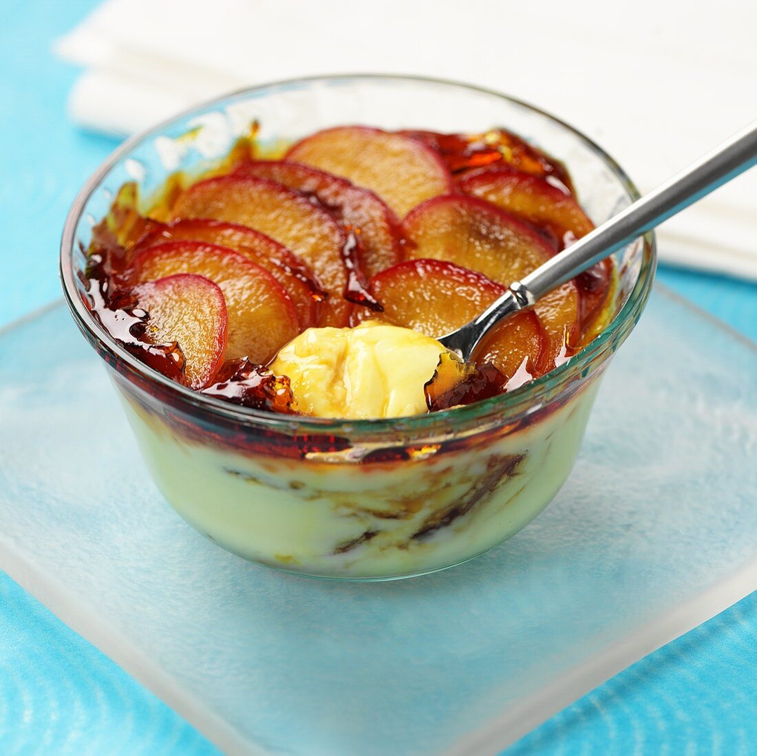 Cream dessert topped with plums