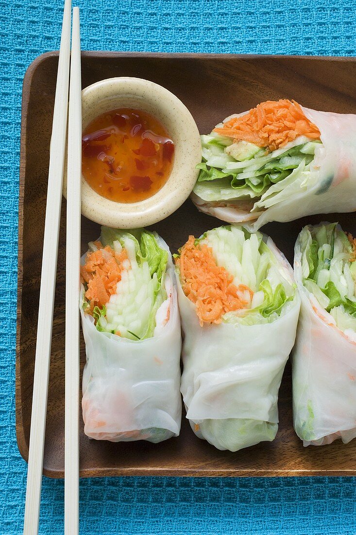 Vietnamese rice paper rolls with dip and chopsticks