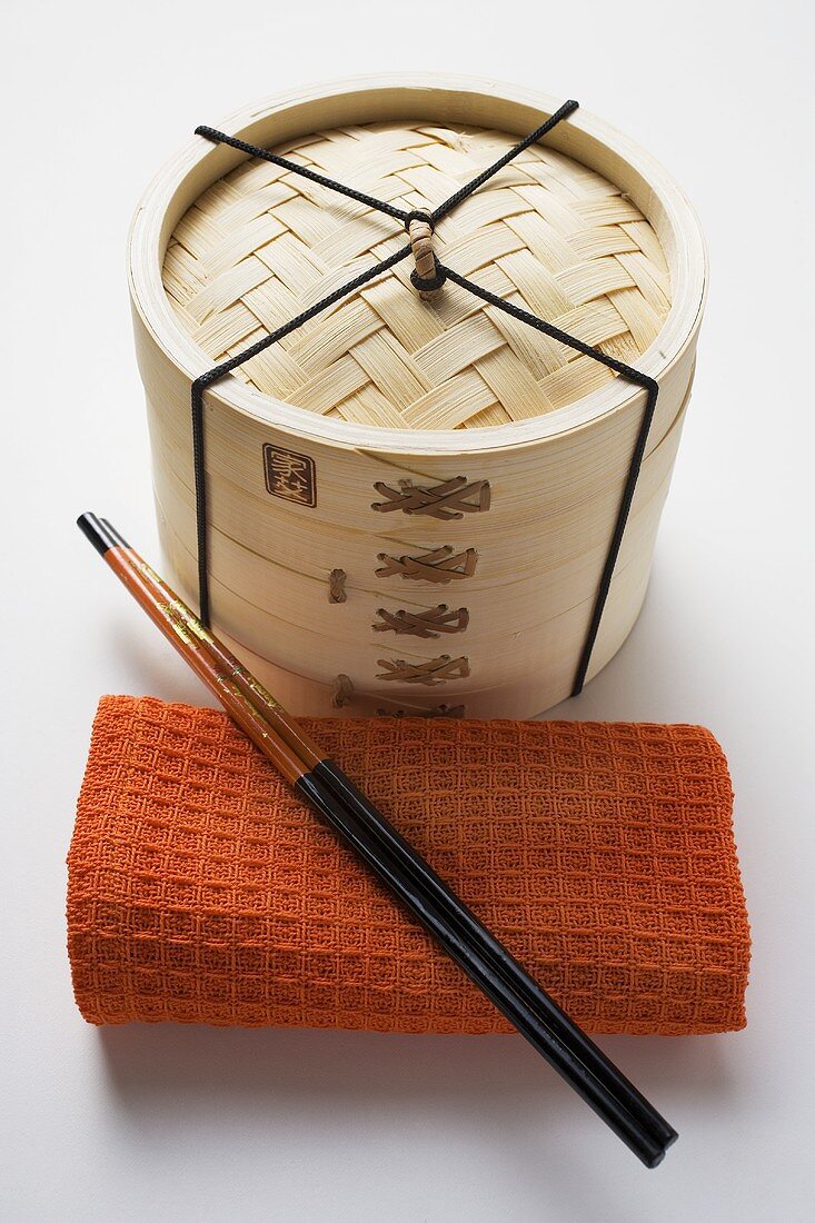 Hand towel, chopsticks and bamboo steamer