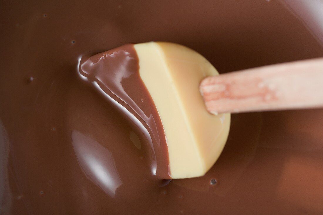 Melted chocolate with mixing spoon