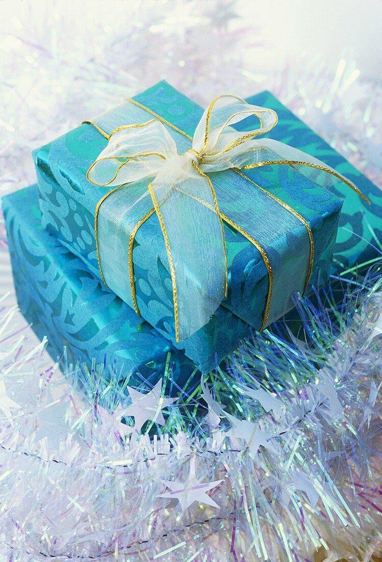 Wrapped gifts, one with bow