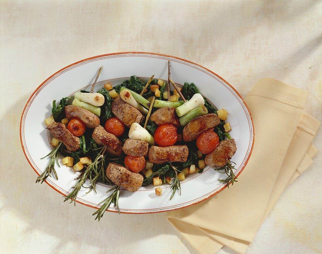 Lamb fillet and vegetables on rosemary skewers