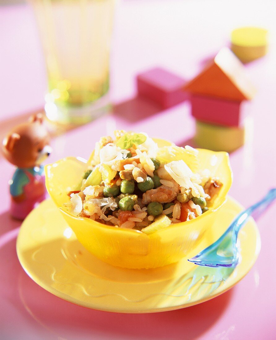 Chicken with rice, vegetables and cheese for children
