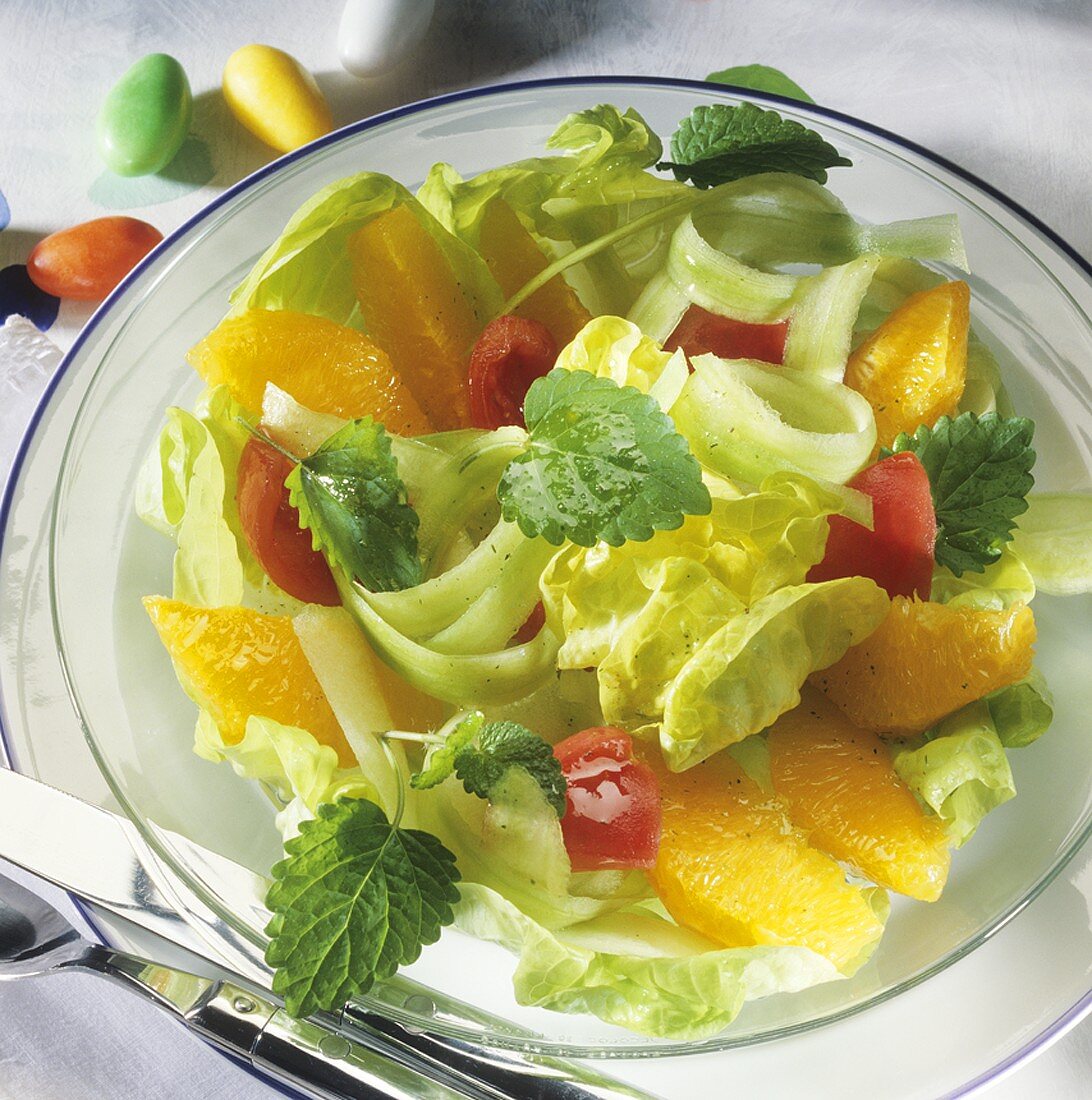Lettuce with orange segments and tomatoes for Easter