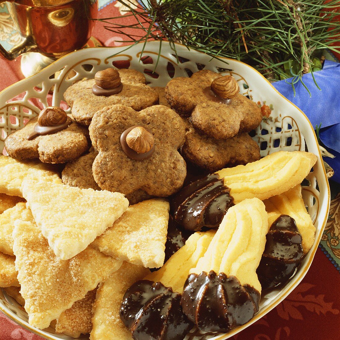 Bowl of chocolate nut biscuits, cinnamon triangles & sweet 'paws'