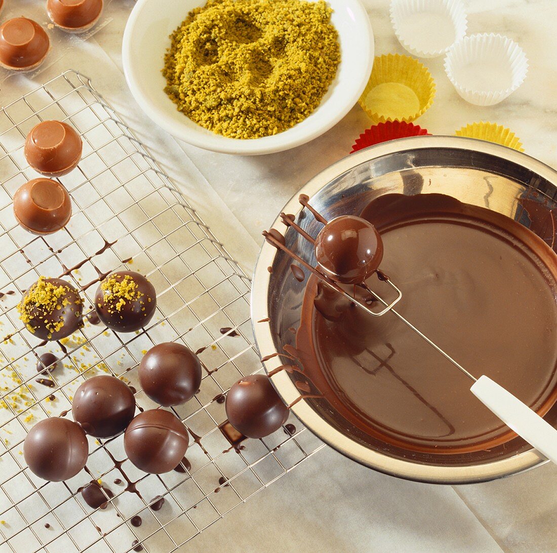 Home-made chocolates with chopped pistachios