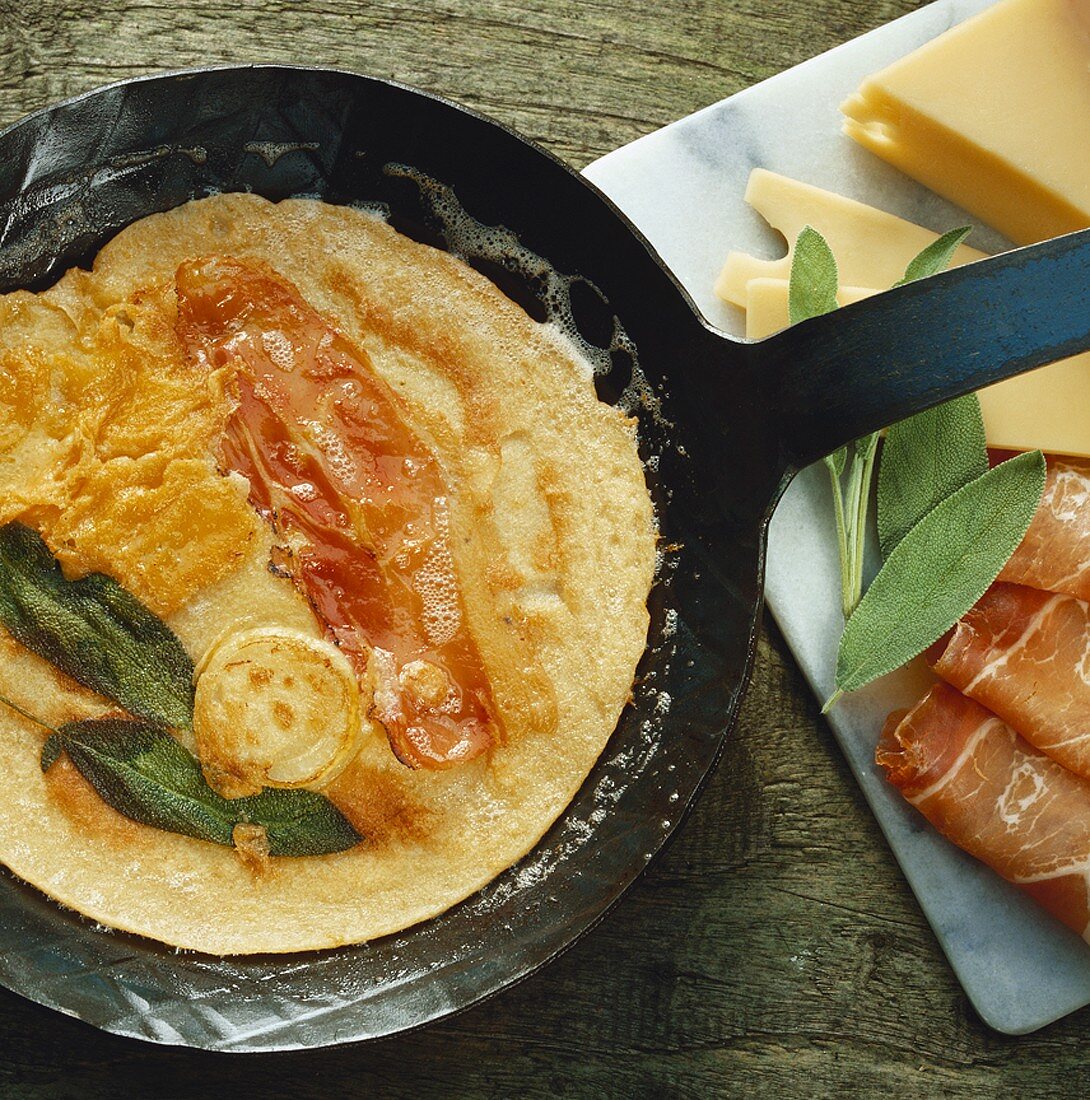 Omelette with bacon, sage and cheese