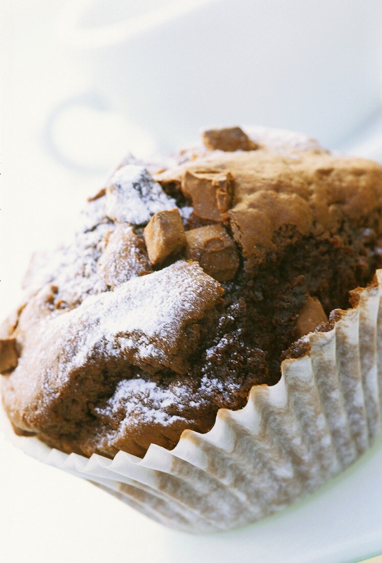 Chocolate muffin with small pieces of toffee