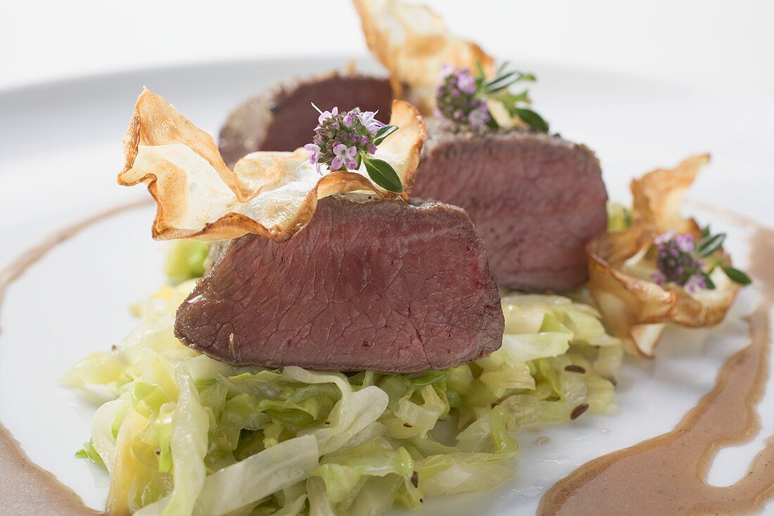 Roast venison fillet with white cabbage