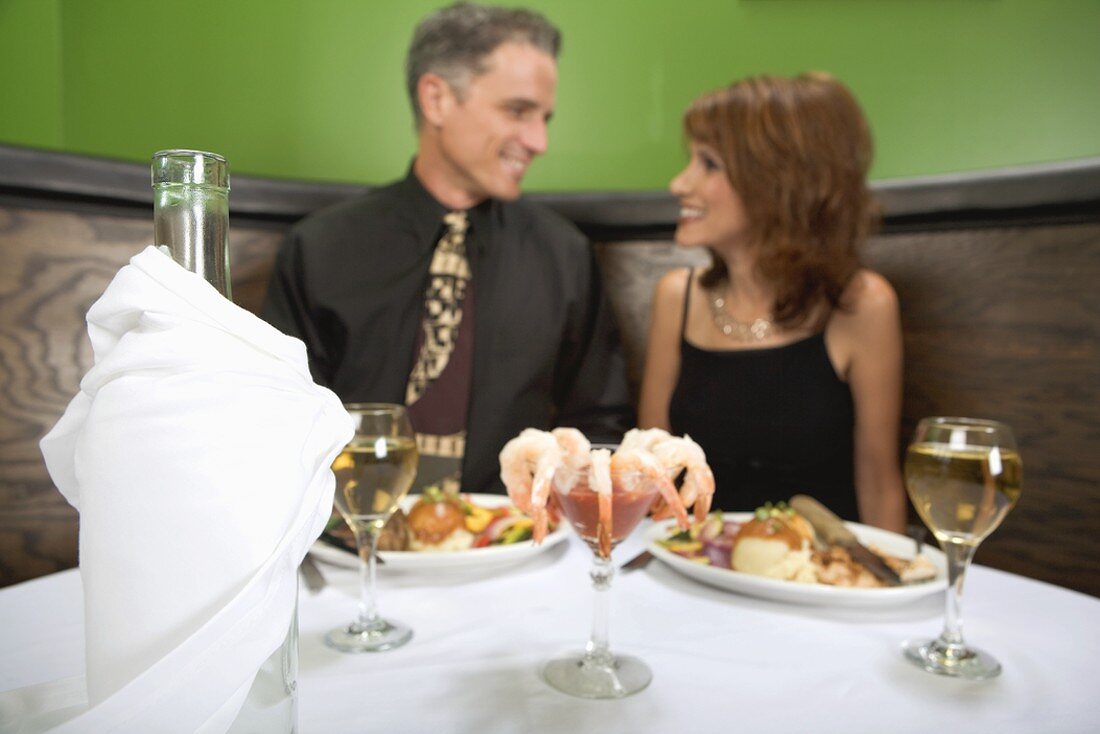 Man and woman having dinner in a restaurant