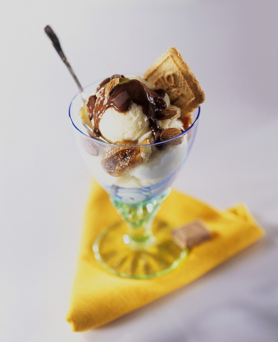 Ice cream sundae with raisins, almonds, fig & chocolate sauce