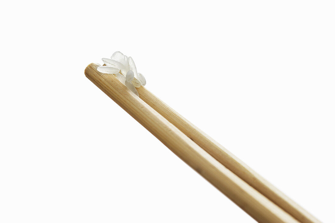 Grains of rice on chopsticks