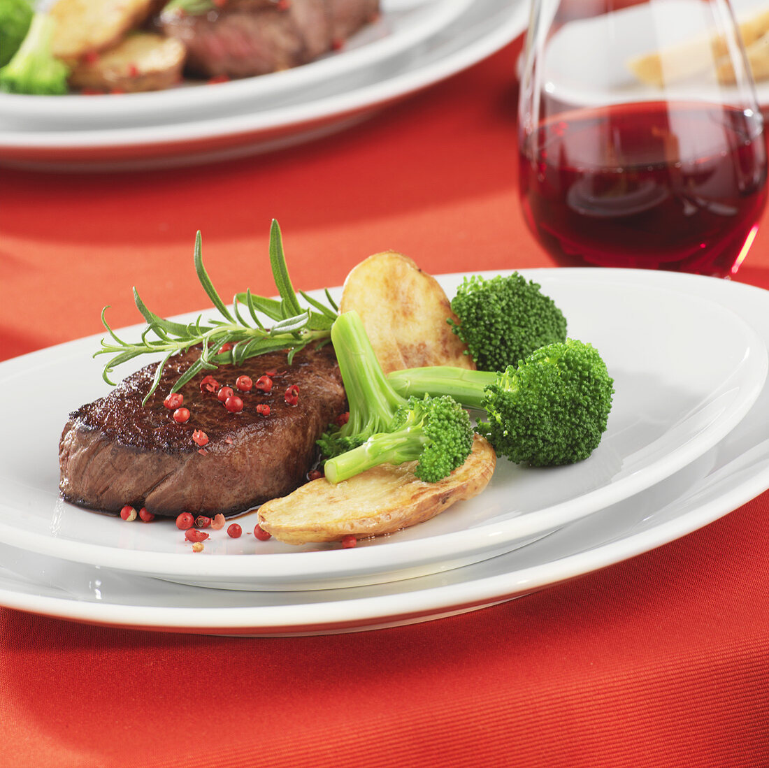 Beef steak with pink peppercorns and vegetables