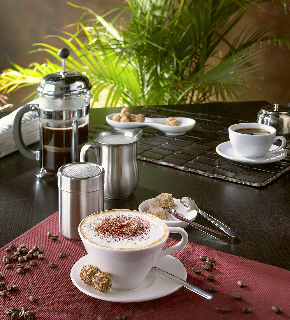 Cappuccino in café setting with coffee beans