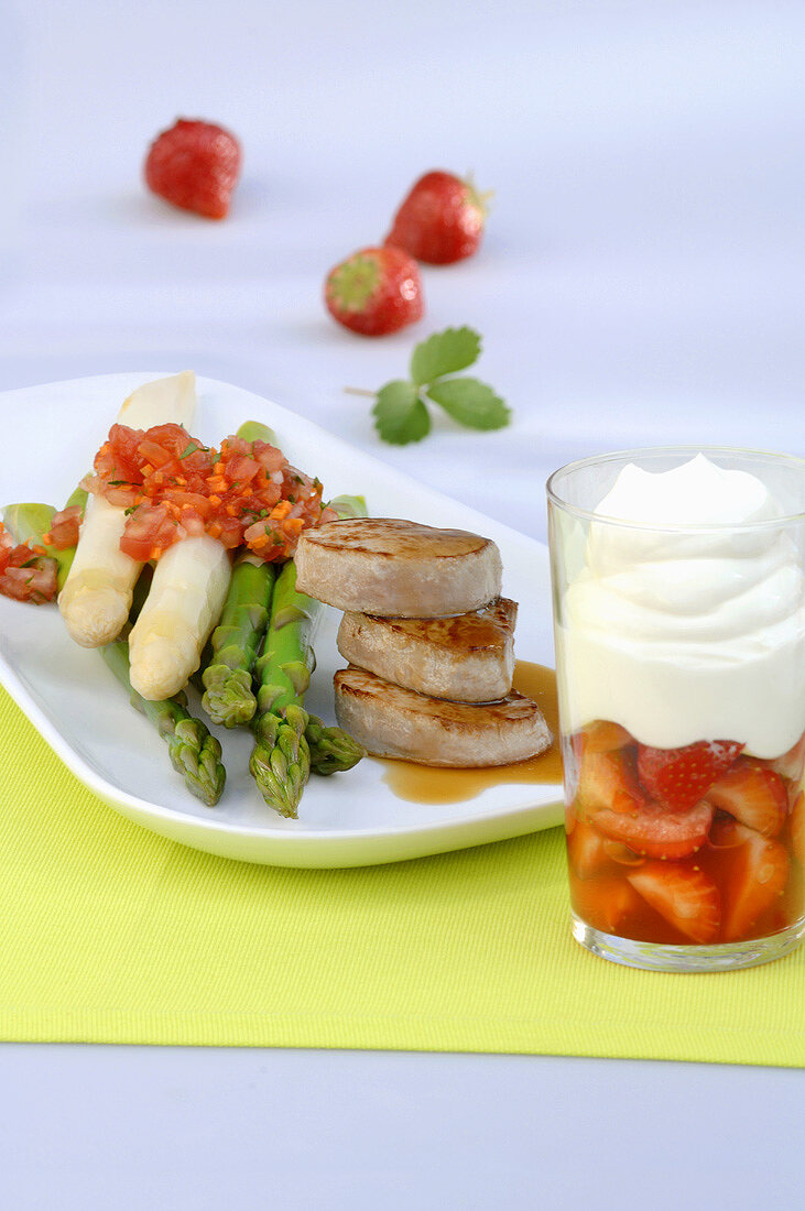 Pork medallions with asparagus & strawberry dessert with cream