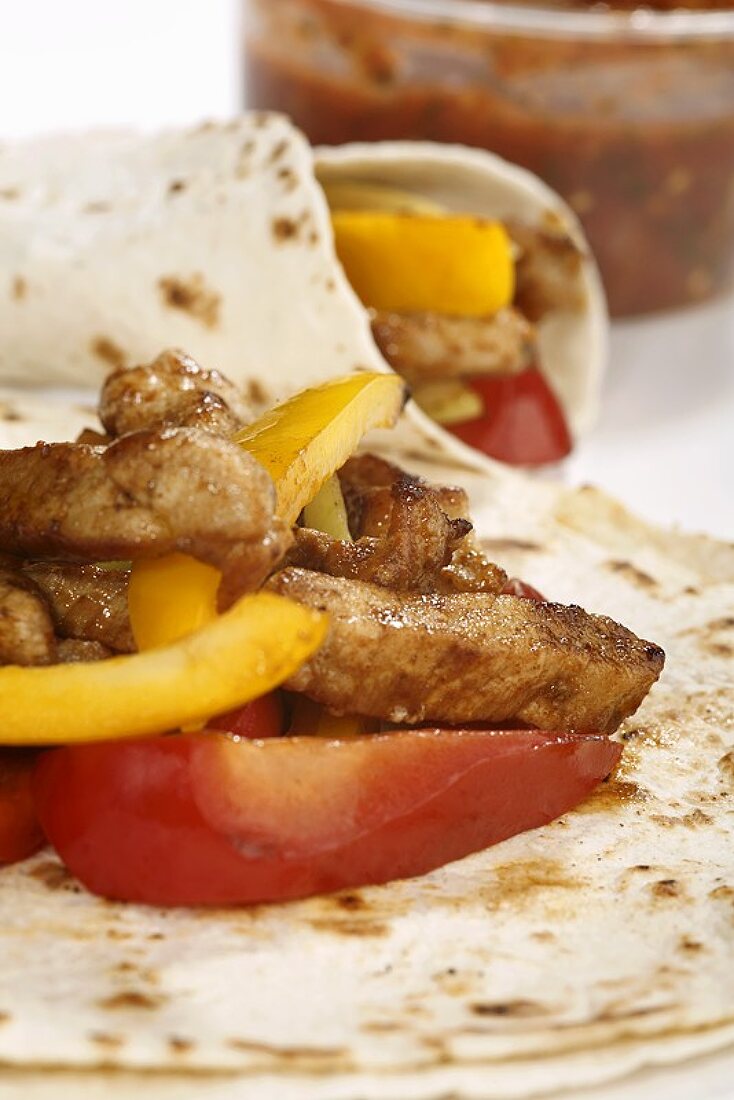 Fajitas filled with pork and peppers