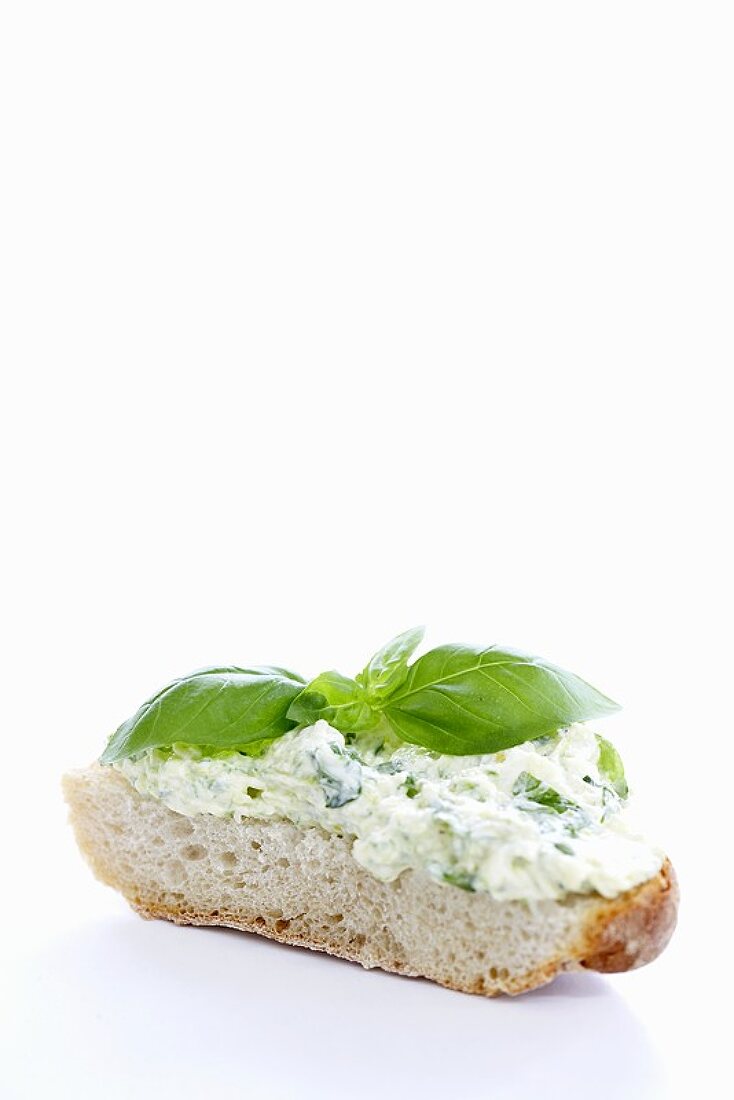 Courgette cream and basil on slice of white bread