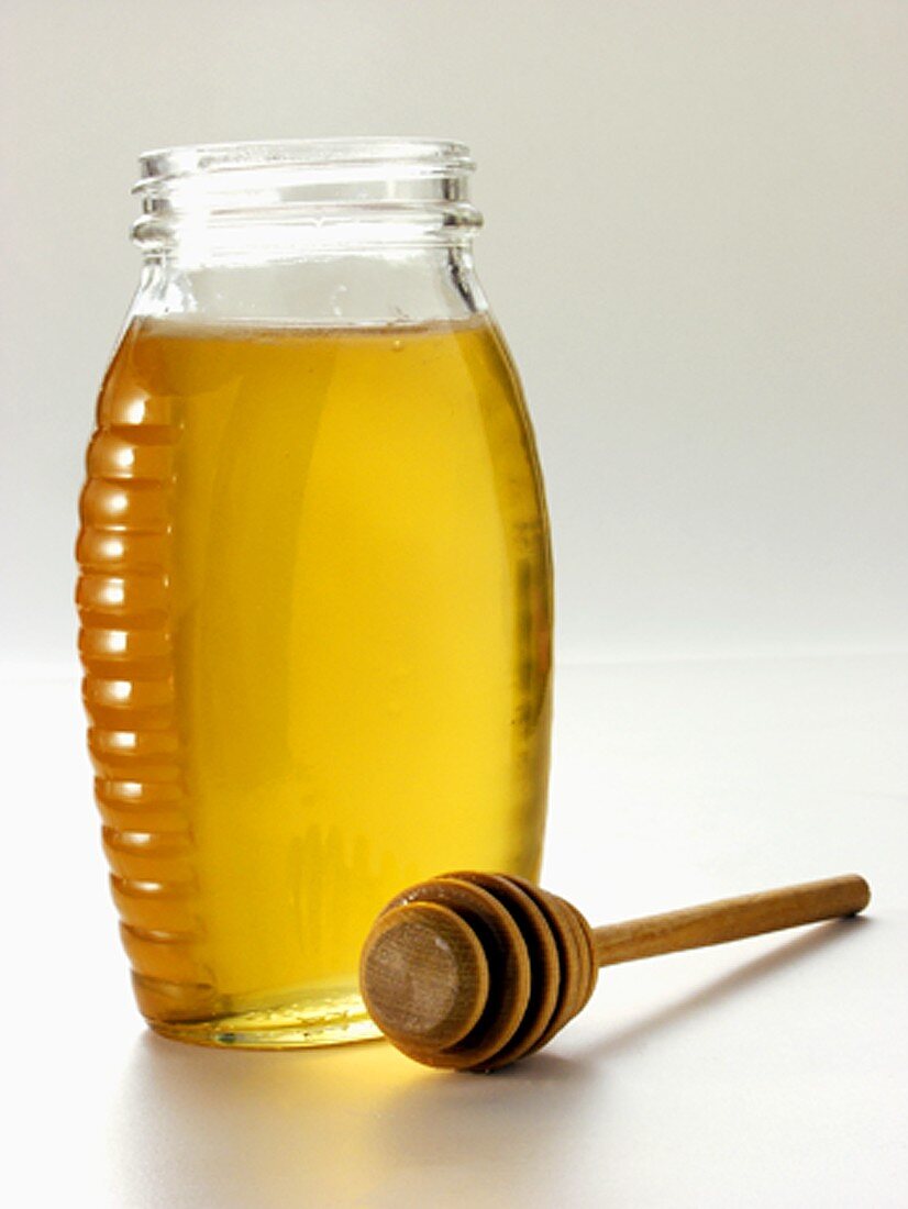 Glas Honig mit Honigkamm