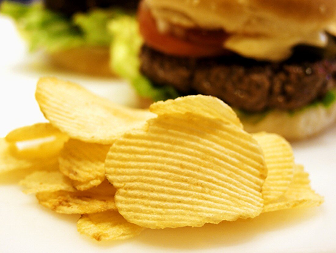 Potato Chips with Hamburger in the Background