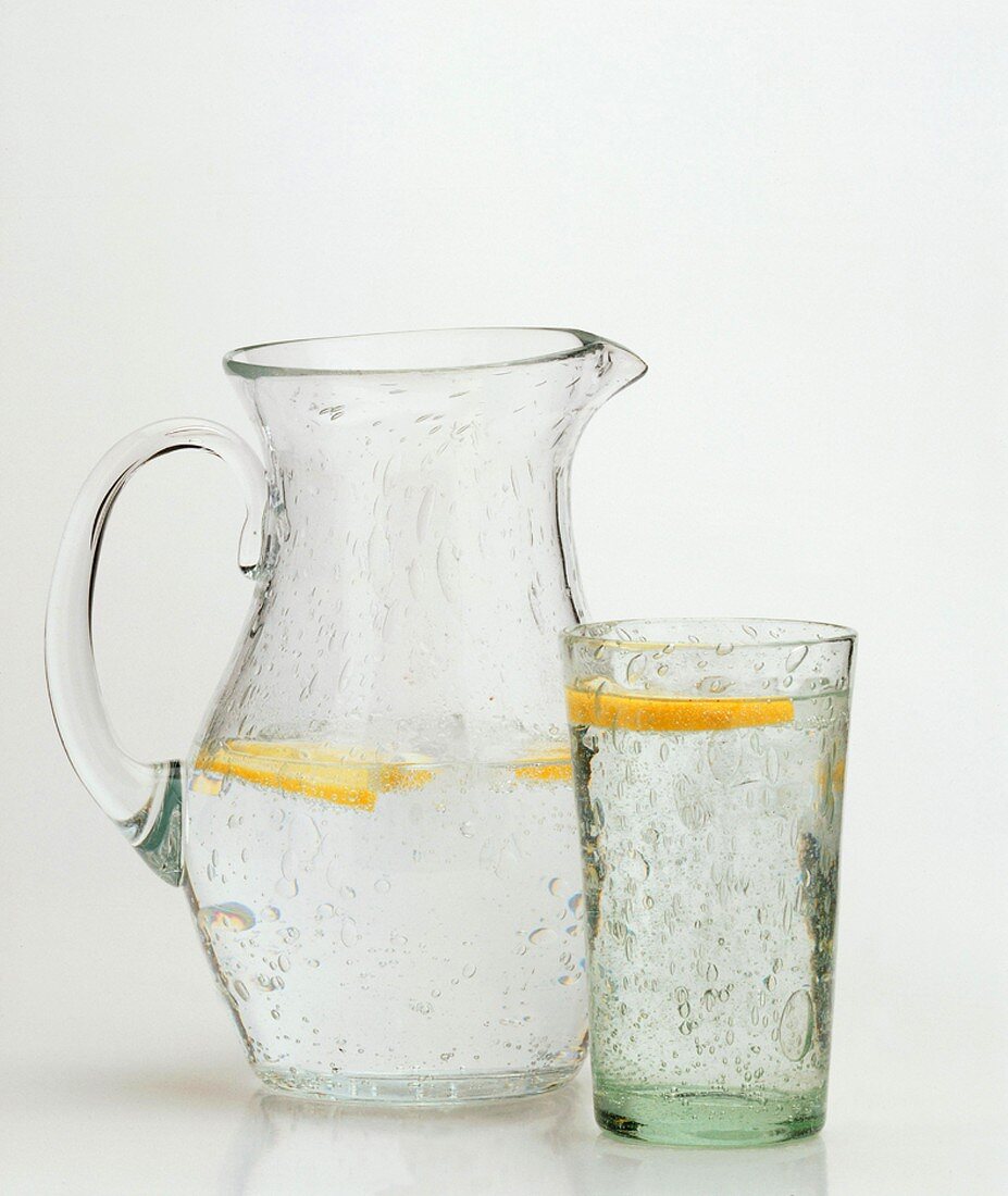 A Pitcher and a Glass of Water; Lemon Slices