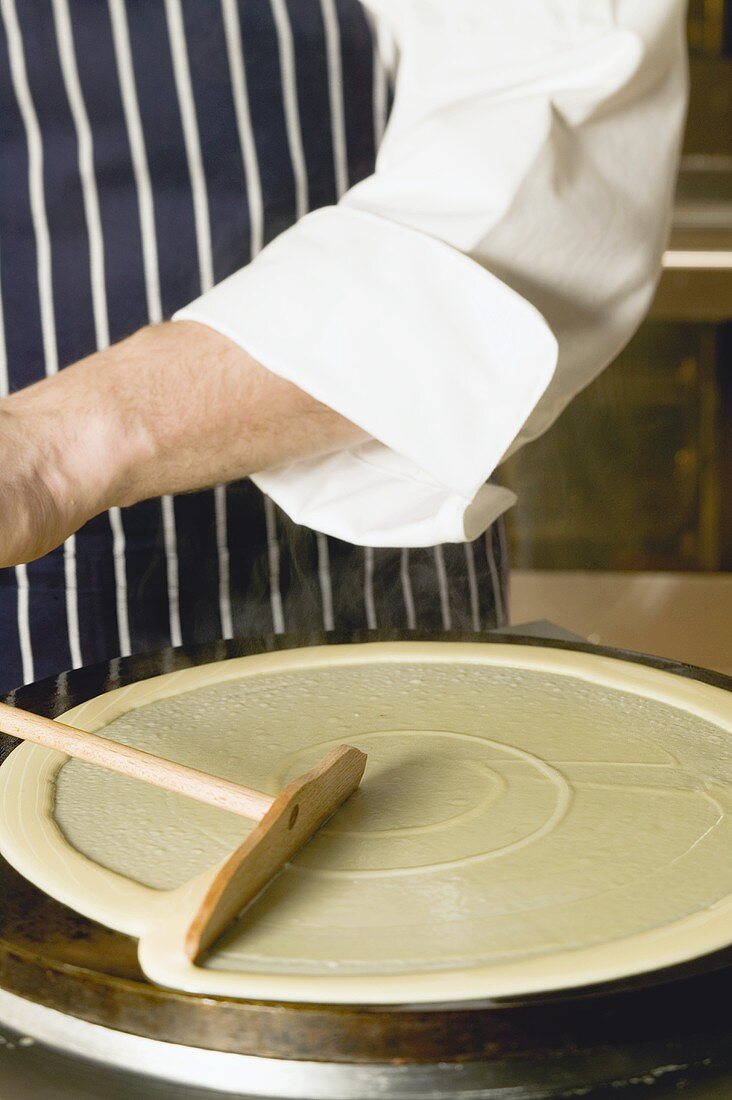 Frying a crepe on a crepe iron