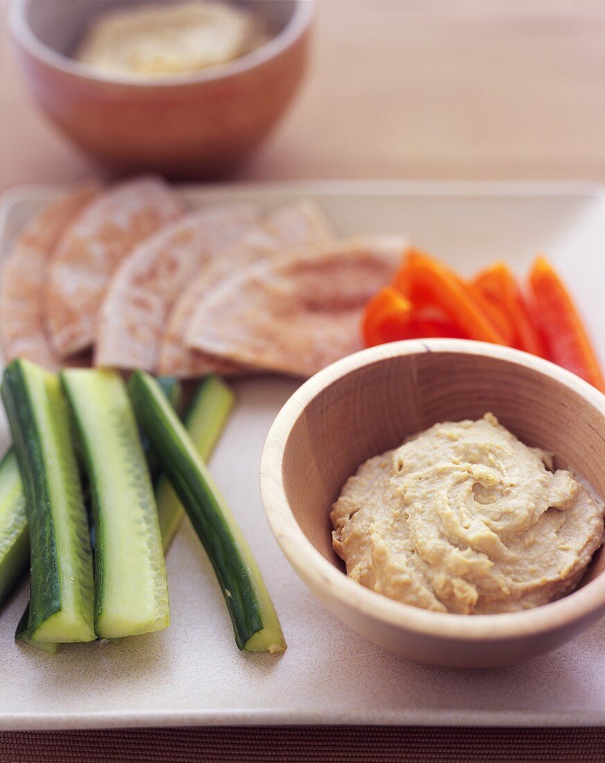 Bowl of Hummus with Vegetables and Pita Bread