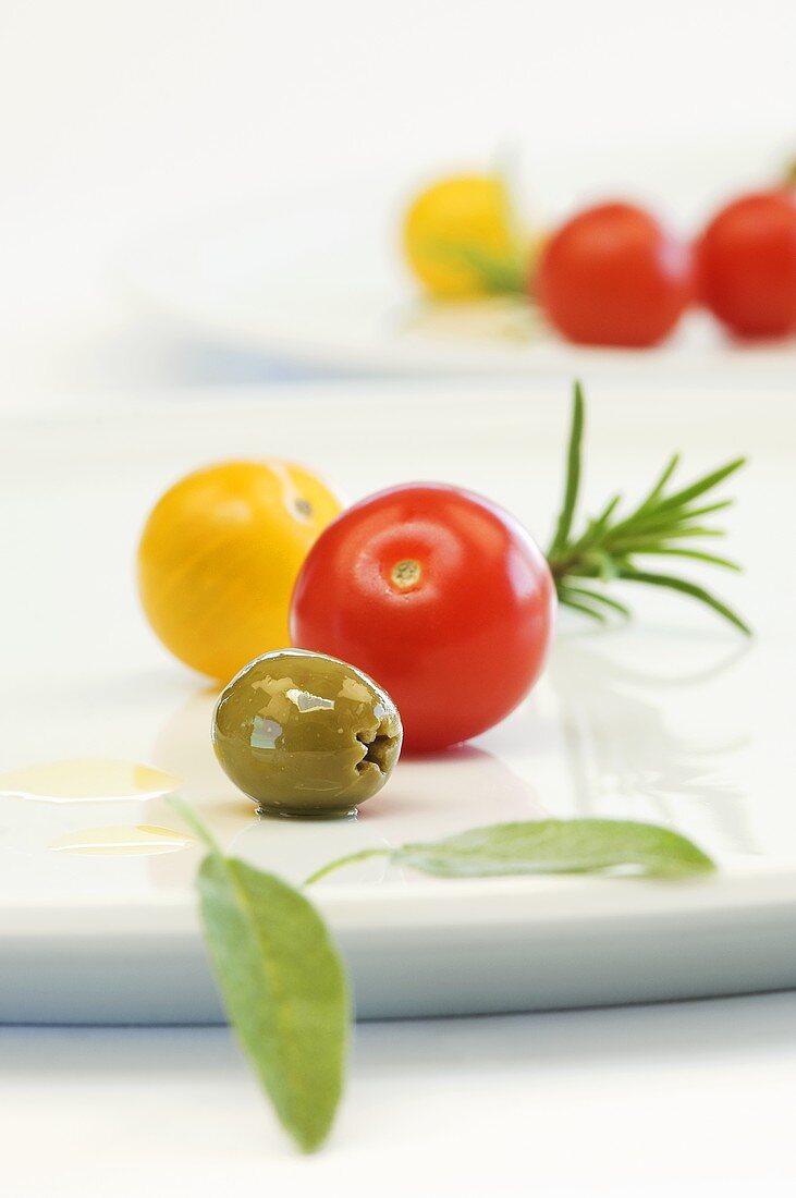 Cherry tomatoes, olives, sage and rosemary