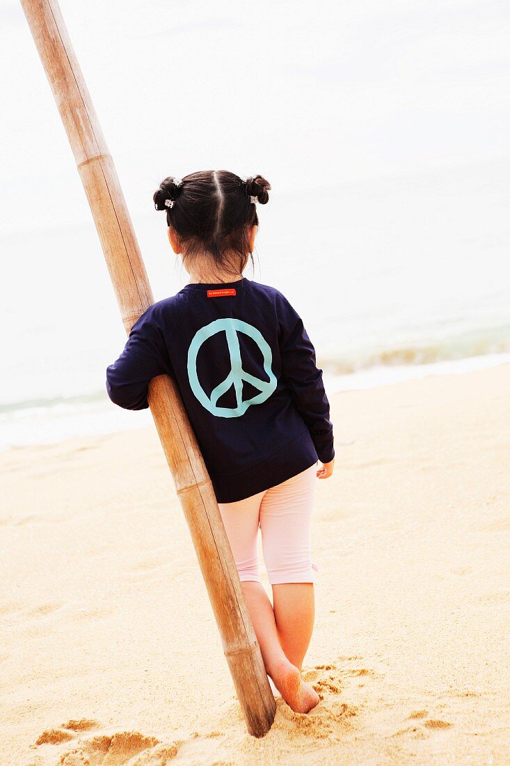 A little girl on a sandy beach