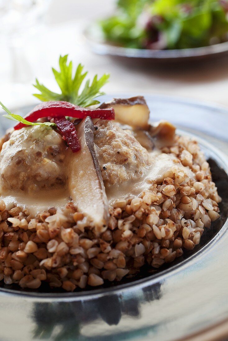 Meatballs with mushroom sauce on buckwheat