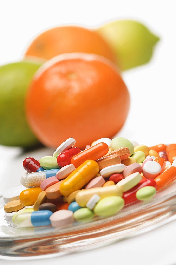 Vitamin tablets and citrus fruits