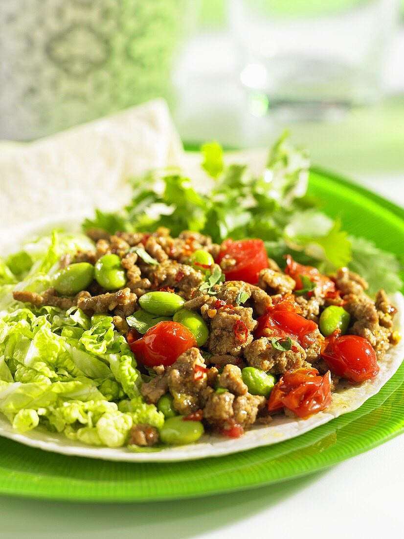 Tortilla with lamb and tomatoes