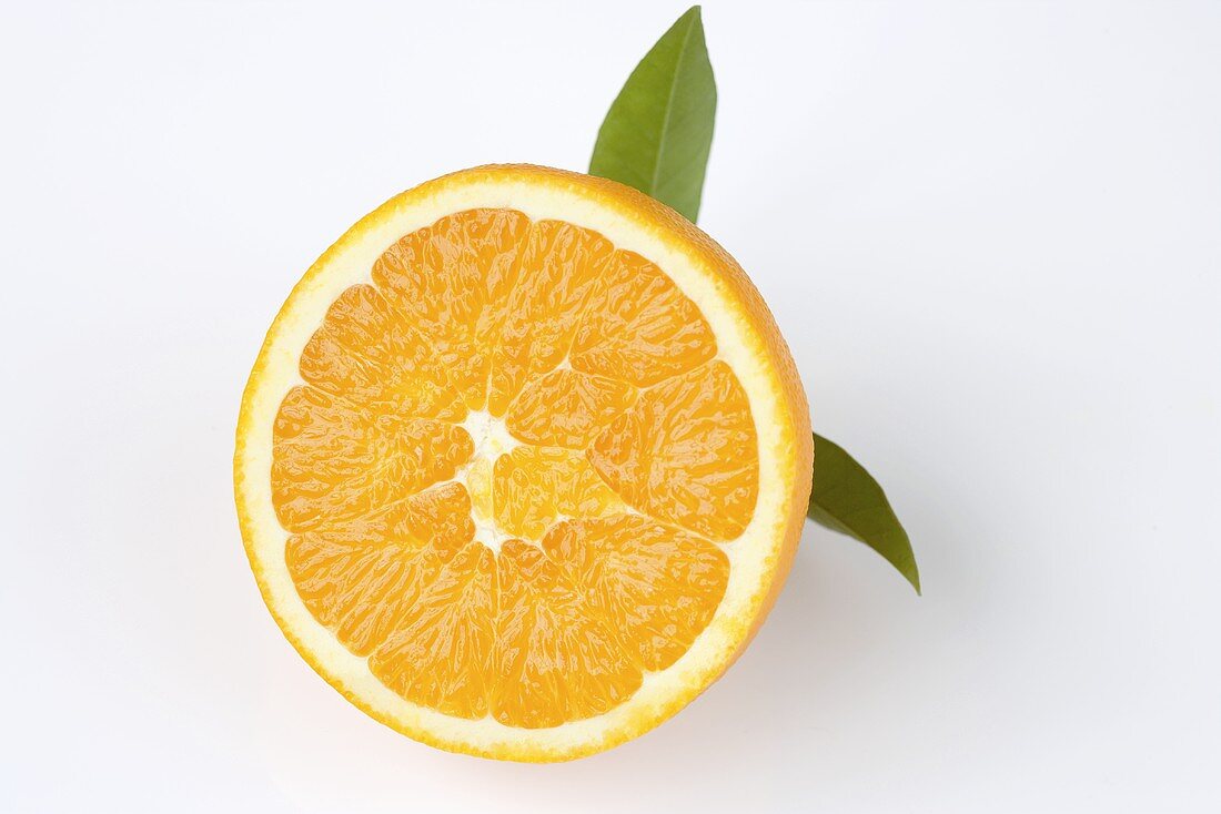 Half an orange with leaves