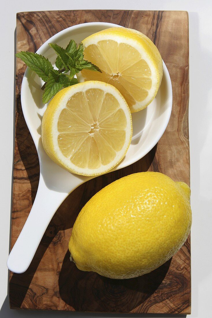 A whole lemon and a halved lemon