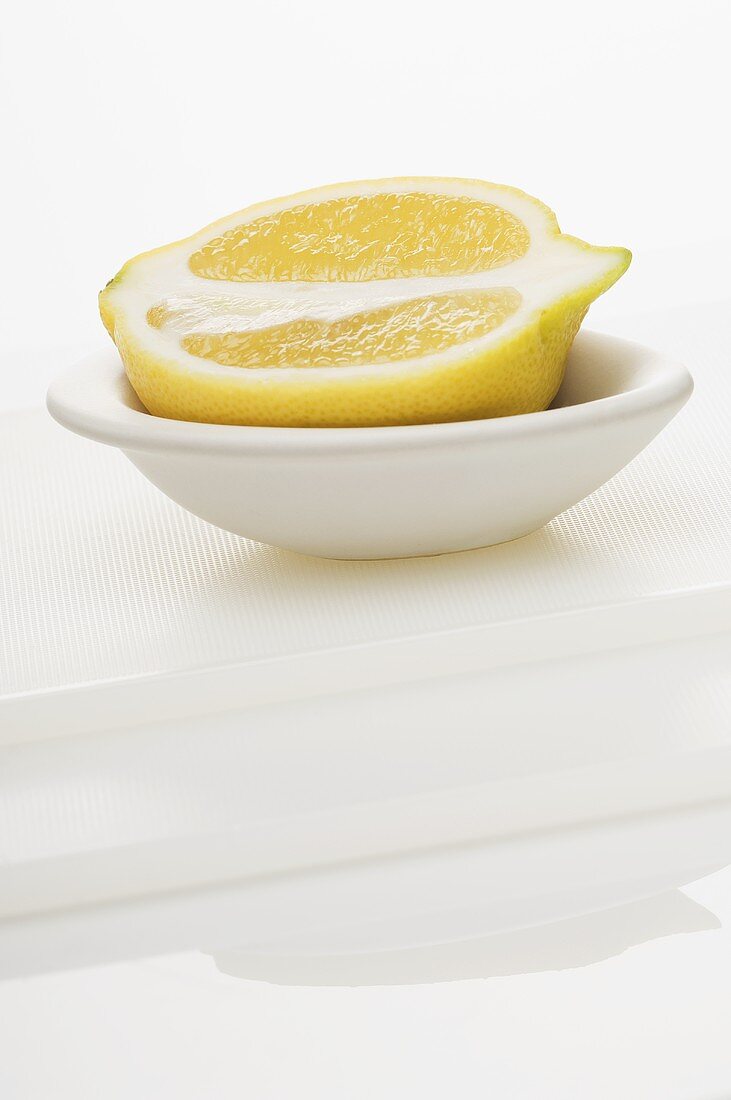 Half a lemon in a bowl