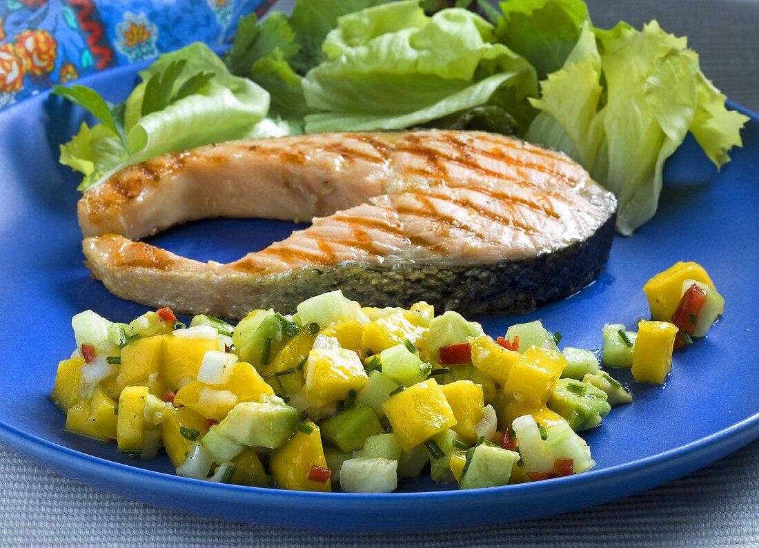 Grilled salmon steak with a mango and avocado salsa