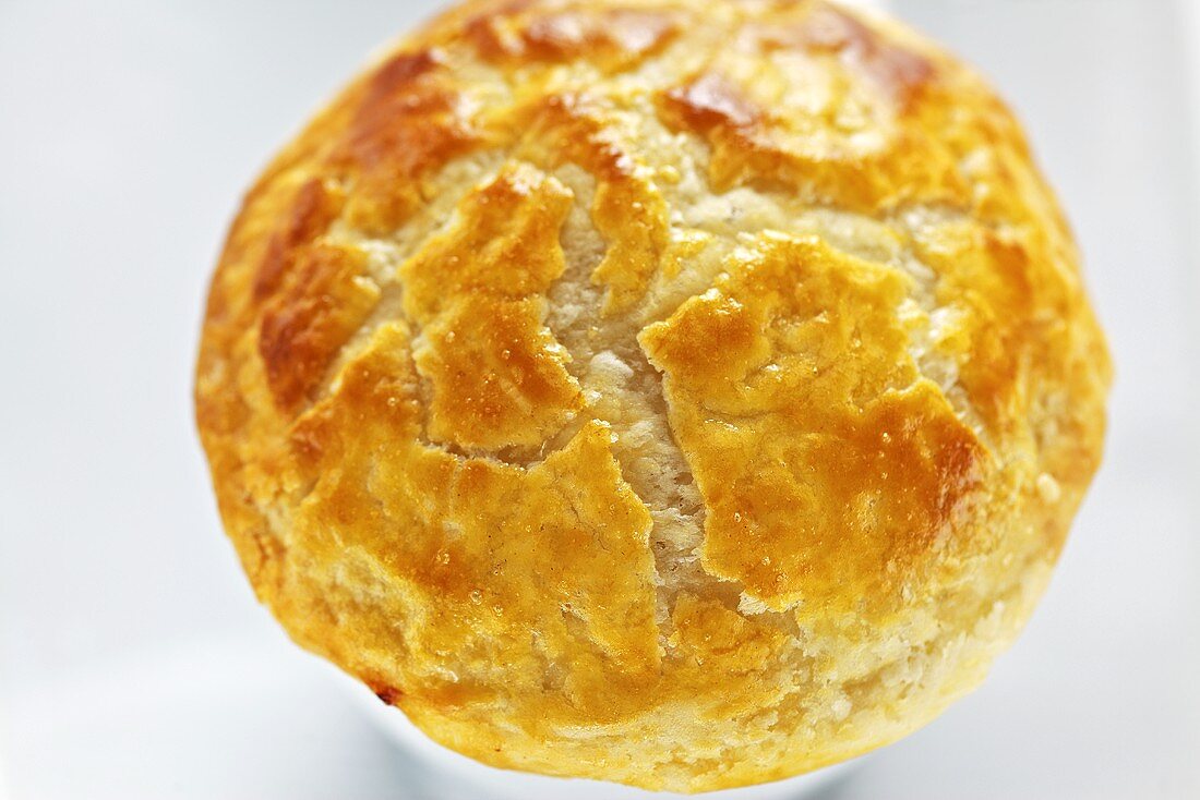 Puff pasty pie baked in a cup (close-up)