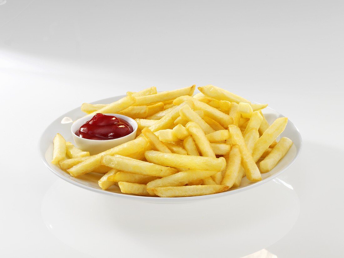 Ketchup on French fries, close-up, elevated view