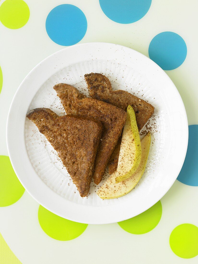 Whole Grain Bread Slices with Pear; Sprinkled with Cocoa Powder