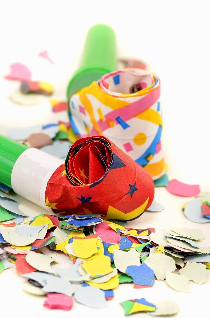 Party blowers and confetti (close-up)