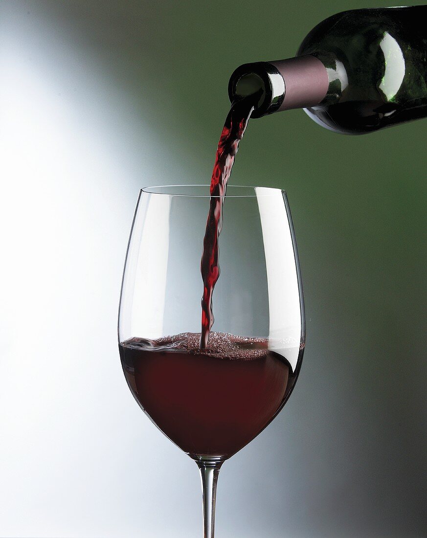 Pouring red wine