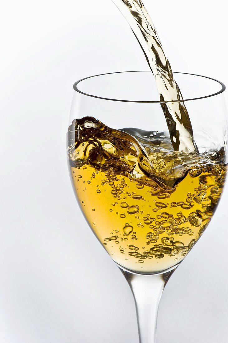 Sauvignon Blanc Wine Pouring into a Glass