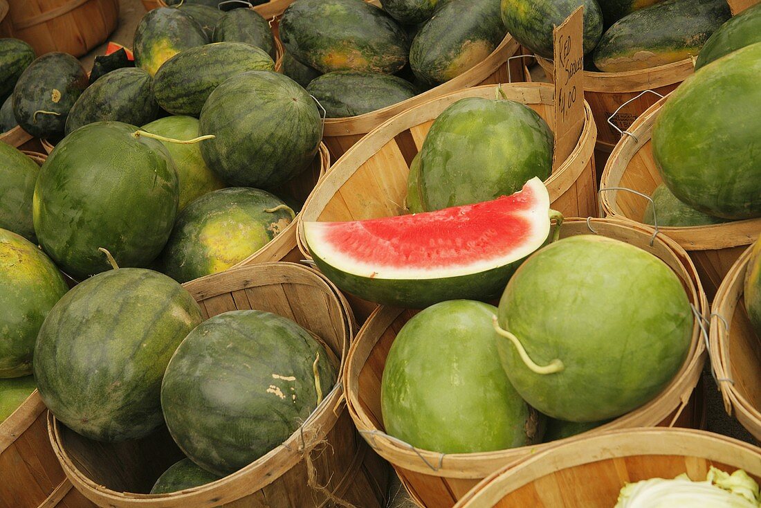 Organic Seedless Watermelon in Wooden Baskets at Farmer's Market