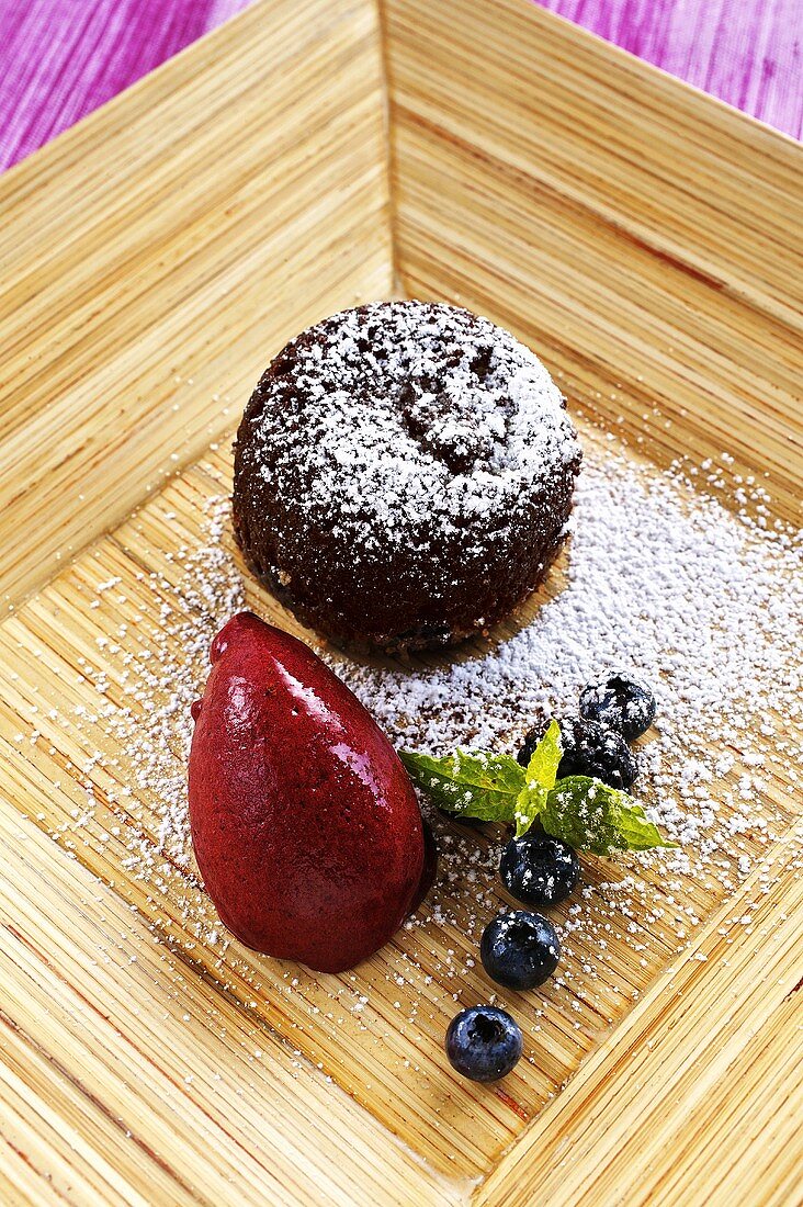 Warm chocolate cake with berry sorbet